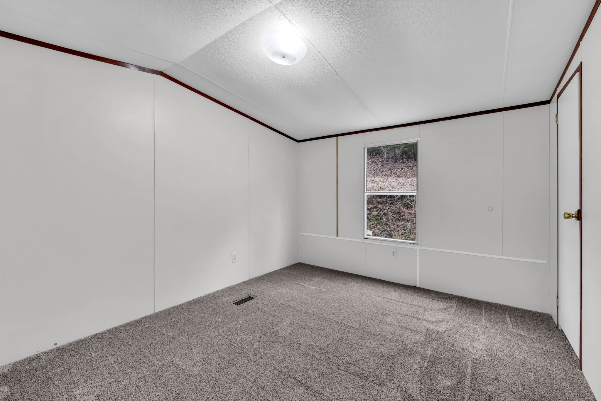 3845 Wickham Road Palmyra, TN 37142 - Photo 17 of 25 a view of an empty room with a window