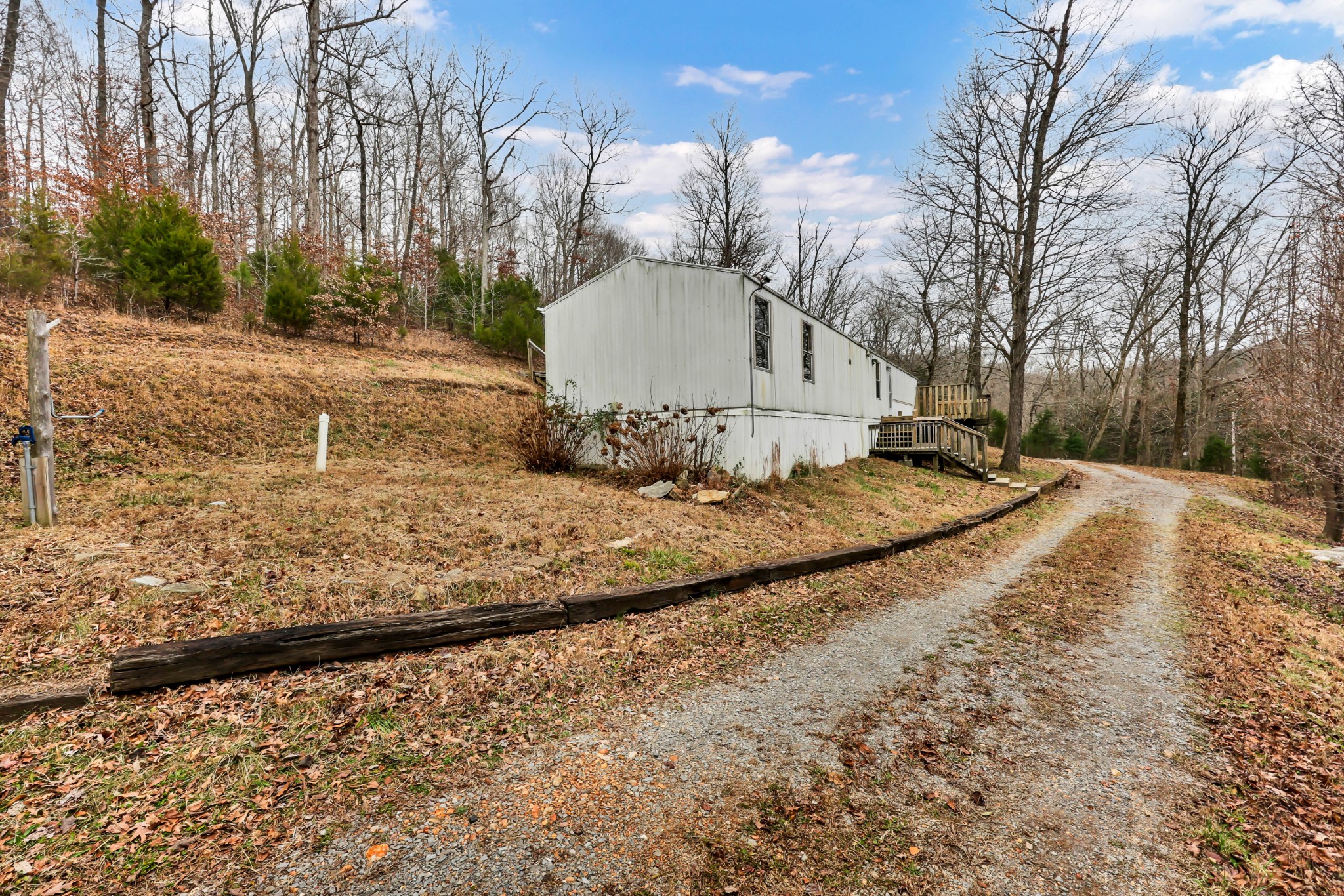 3845 Wickham Road Palmyra, TN 37142 - Photo 2 of 25 a view of a backyard of house