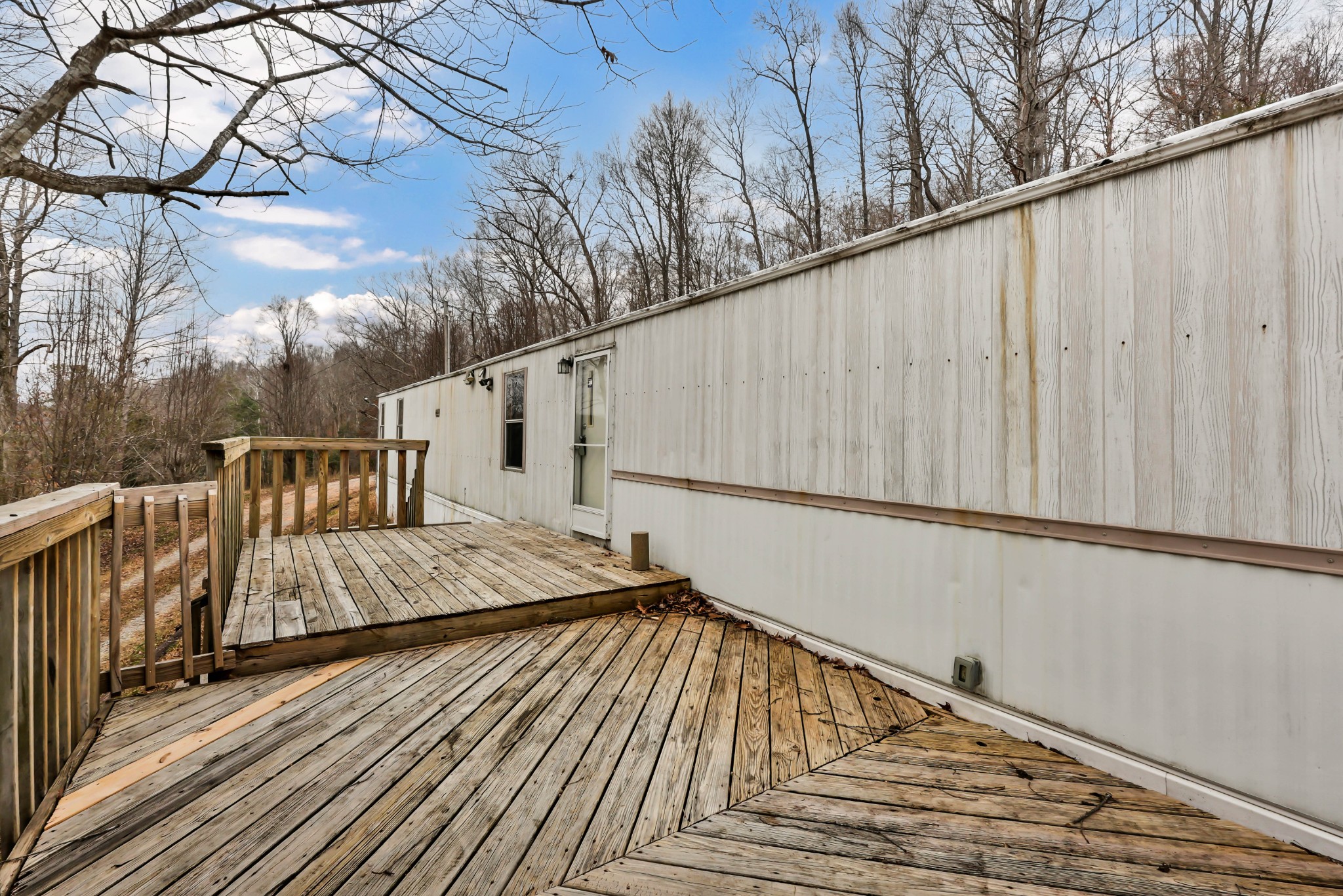 3845 Wickham Road Palmyra, TN 37142 - Photo 3 of 25 a balcony with wooden floor and fence
