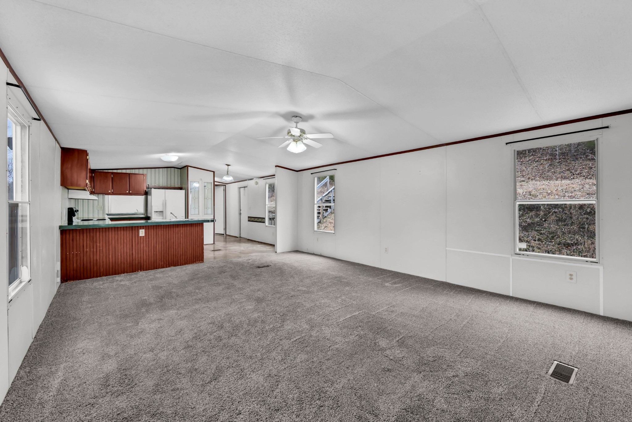 3845 Wickham Road Palmyra, TN 37142 - Photo 6 of 25 a view of a kitchen with a dishwasher and cabinets