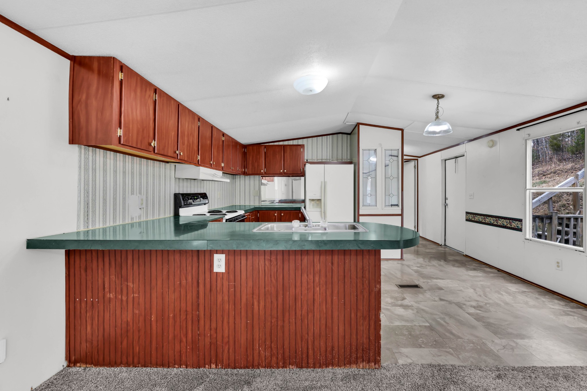3845 Wickham Road Palmyra, TN 37142 - Photo 8 of 25 a kitchen with granite countertop wooden cabinets a stove a sink and a stainless steel appliances
