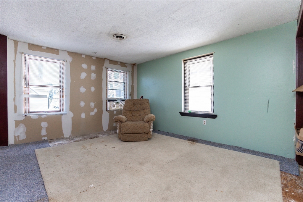 9 Barton Street Salem, MA 01970 - Photo 14 of 26 a living room with furniture and windows