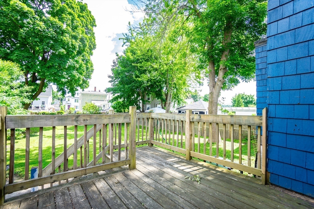 9 Barton Street Salem, MA 01970 - Photo 20 of 26 a view of balcony with wooden floor and fence