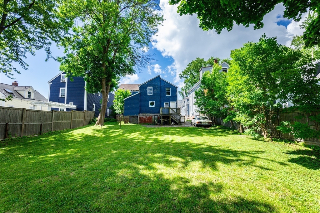 9 Barton Street Salem, MA 01970 - Photo 21 of 26 a view of a house with a backyard