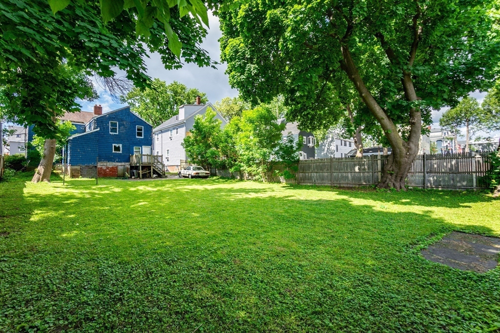 9 Barton Street Salem, MA 01970 - Photo 22 of 26 a view of a house with a yard