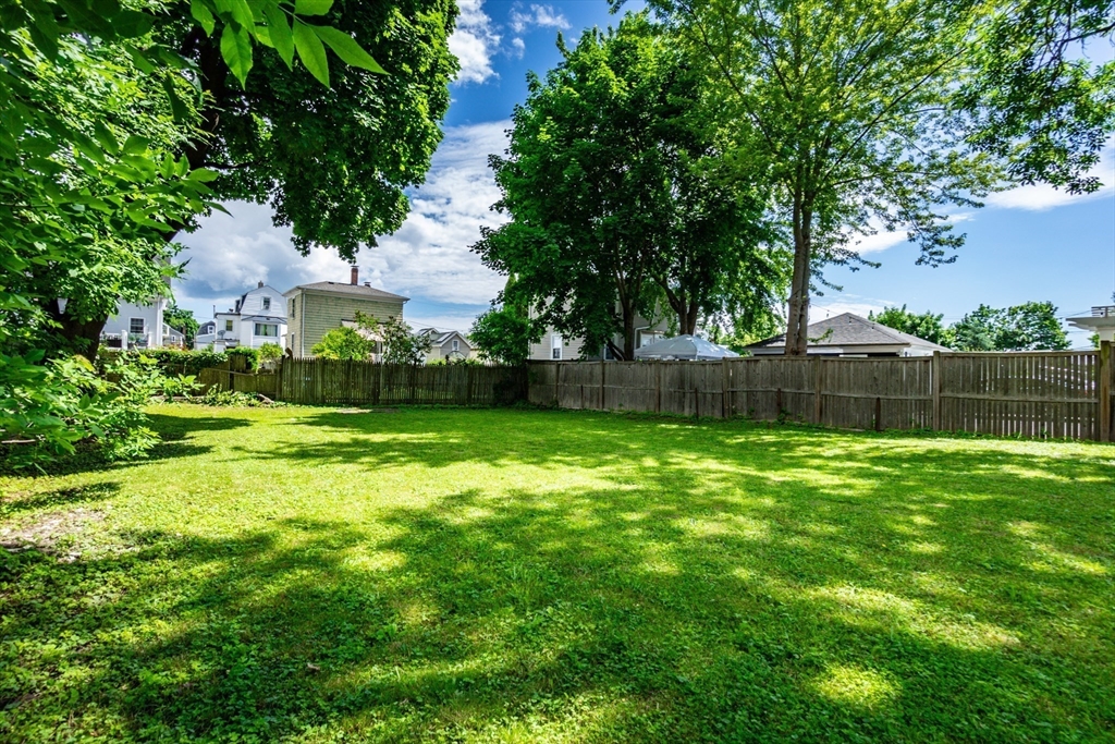 9 Barton Street Salem, MA 01970 - Photo 23 of 26 a view of a backyard with a garden
