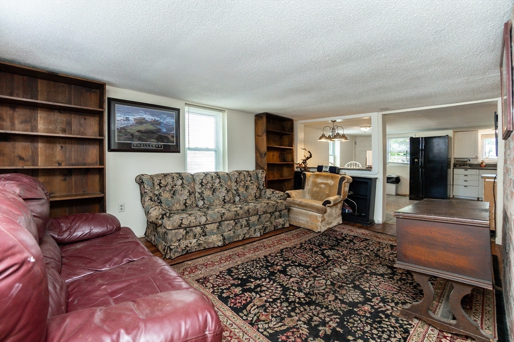 9 Barton Street Salem, MA 01970 - Photo 3 of 26 a living room with furniture and a couch