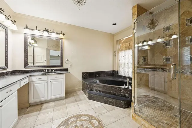 a kitchen with granite countertop a refrigerator and a sink