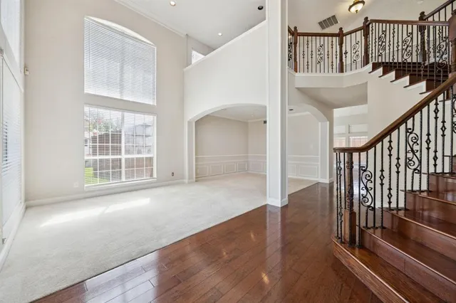 a view of an entryway with wooden floor
