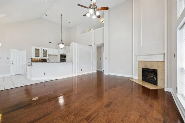 a view of a kitchen with wooden floor and a kitchen