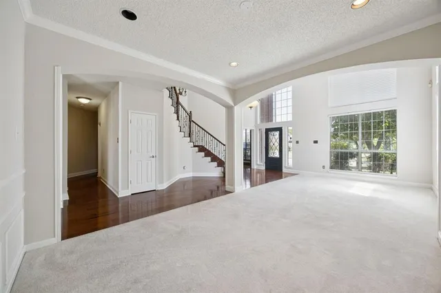 a view of a big room with closet and windows