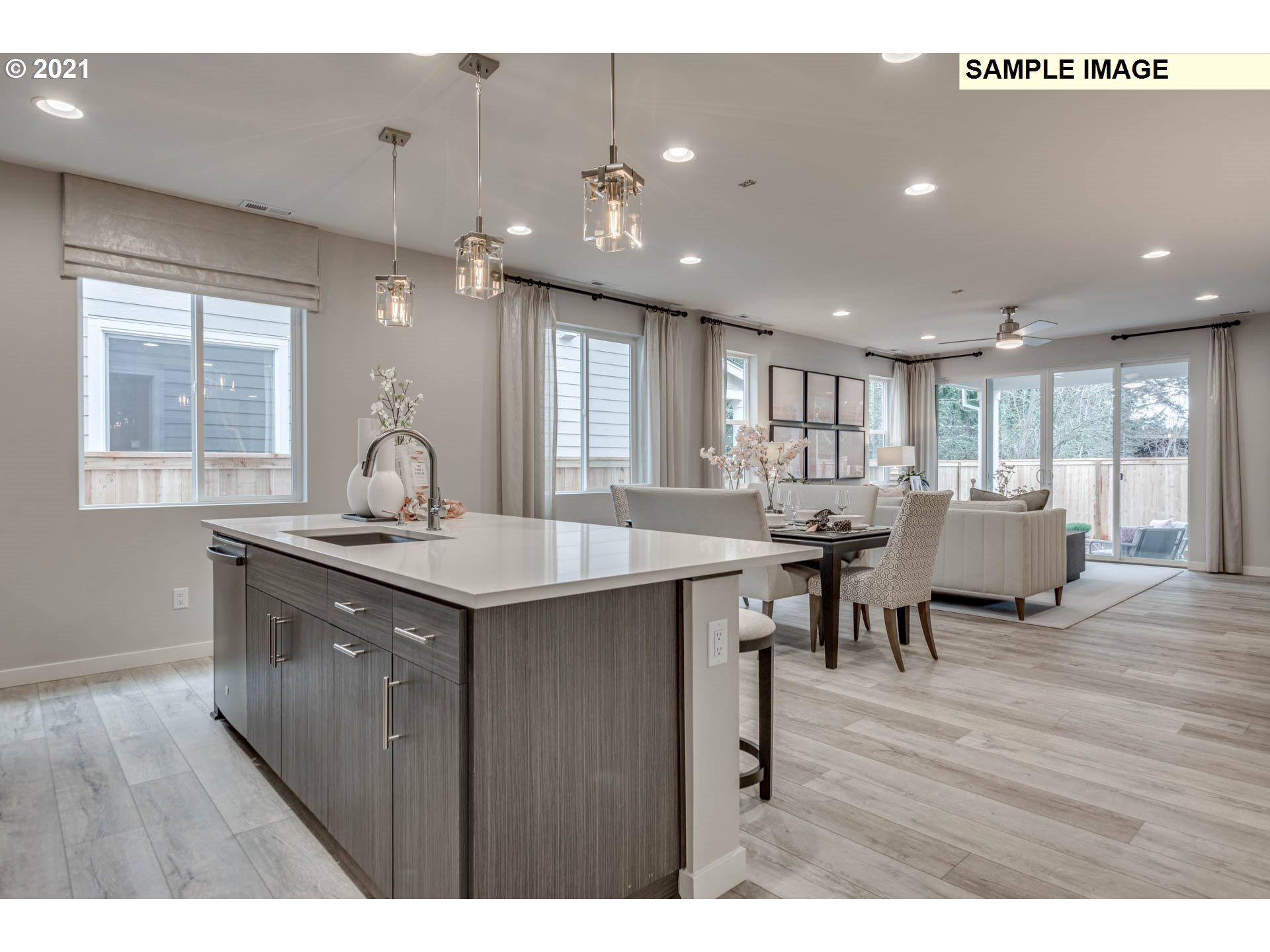 537 North 32nd Avenue Ridgefield, WA 98642 - Photo 5 of 15 a kitchen with a dining table chairs and wooden floor