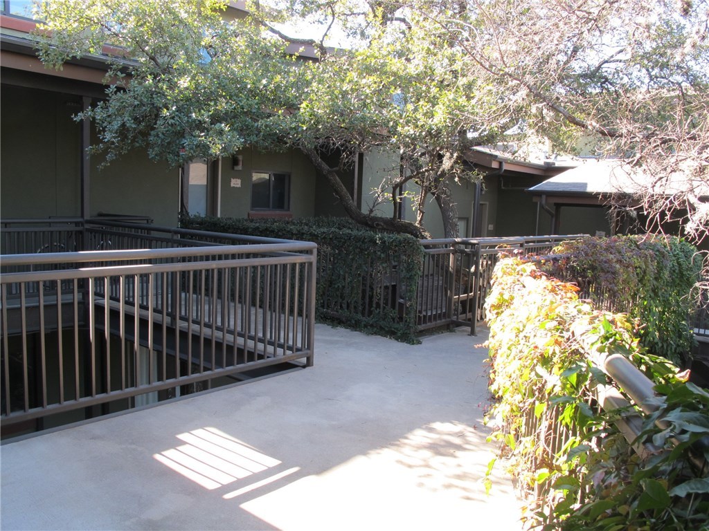 911 Keith Lane, Unit 10 Austin, TX 78705 - Photo 19 of 20 a view of street with wooden fence