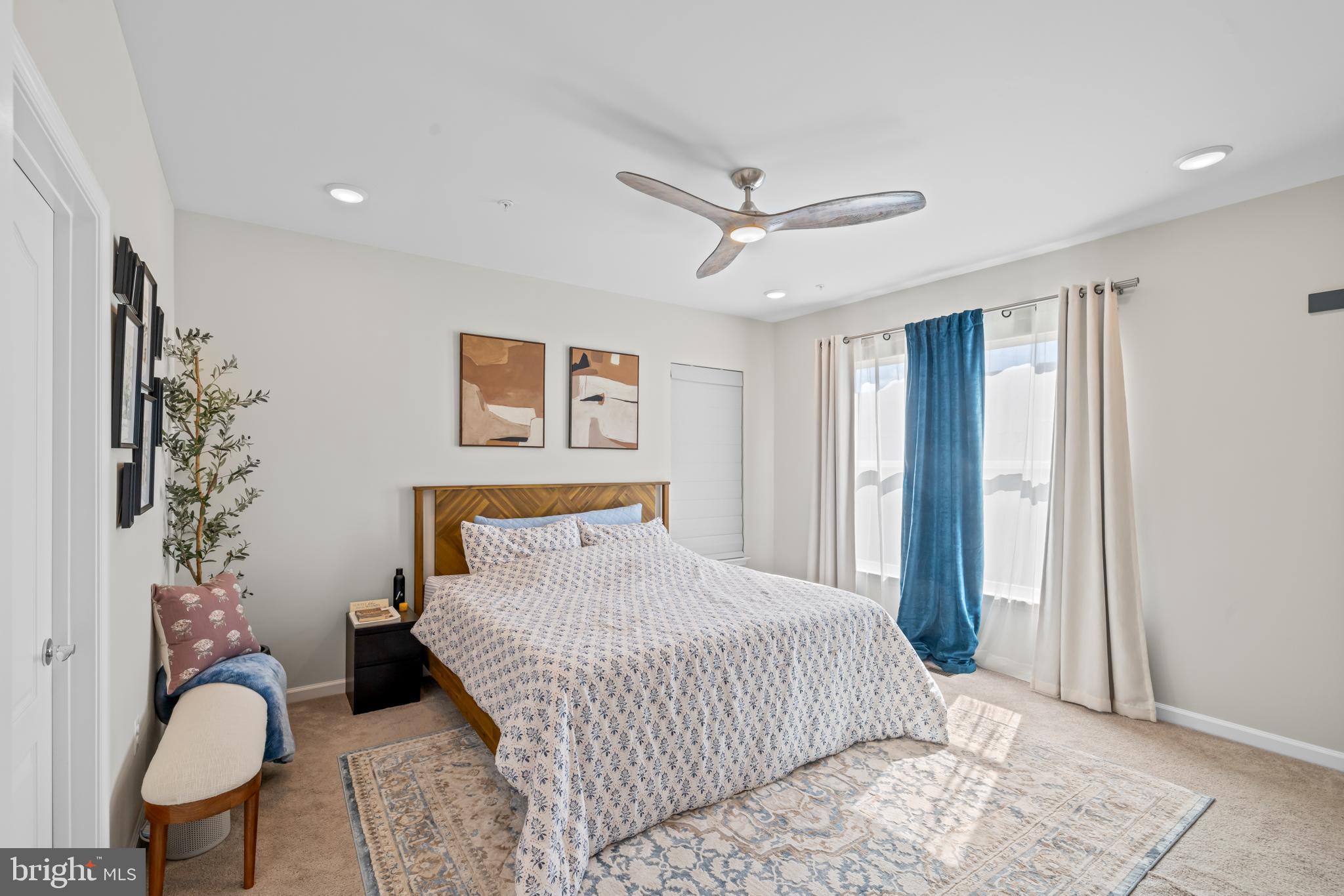 7715 Cresap Lane Hanover, MD 21076 - Photo 20 of 42 a bedroom with a large bed and a chandelier