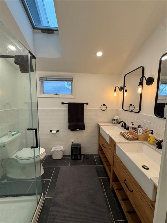 390 Locust Street Indiana, PA 15701 - Photo 14 of 21 a spacious bathroom with a double vanity sink a mirror and a shower