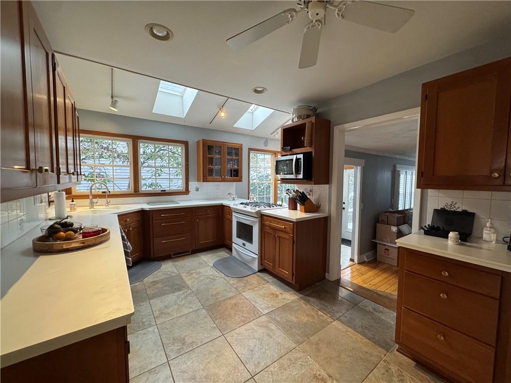 390 Locust Street Indiana, PA 15701 - Photo 6 of 21 a large kitchen with a large counter top space appliances and cabinets