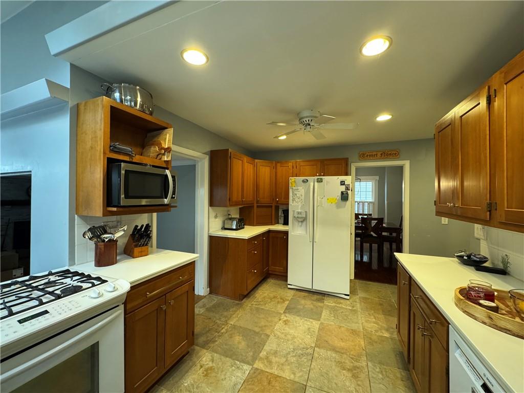 390 Locust Street Indiana, PA 15701 - Photo 7 of 21 a kitchen with stainless steel appliances granite countertop a sink stove and refrigerator