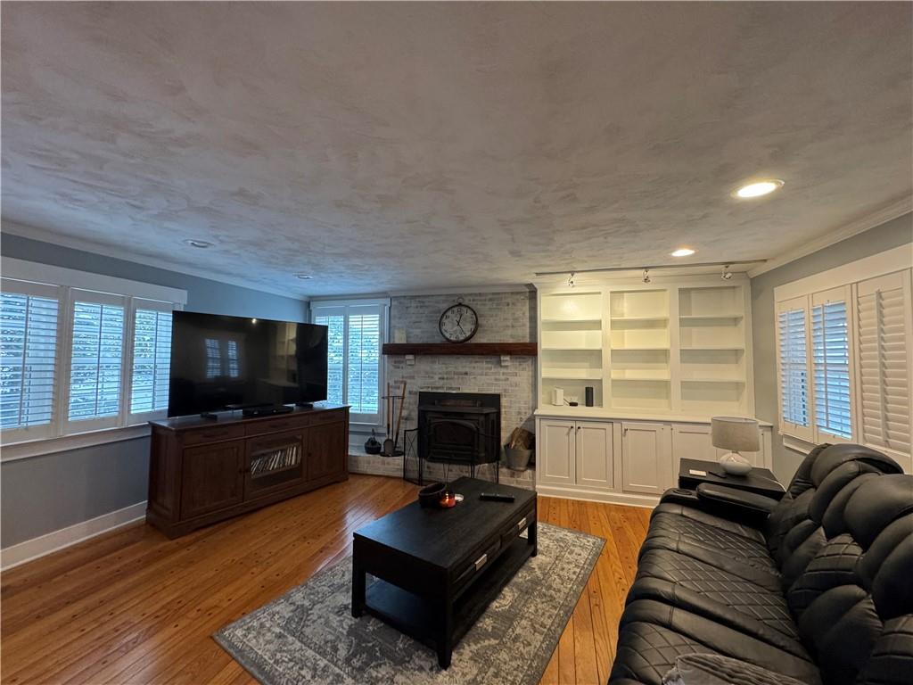 390 Locust Street Indiana, PA 15701 - Photo 10 of 21 a living room with furniture a flat screen tv and a fireplace