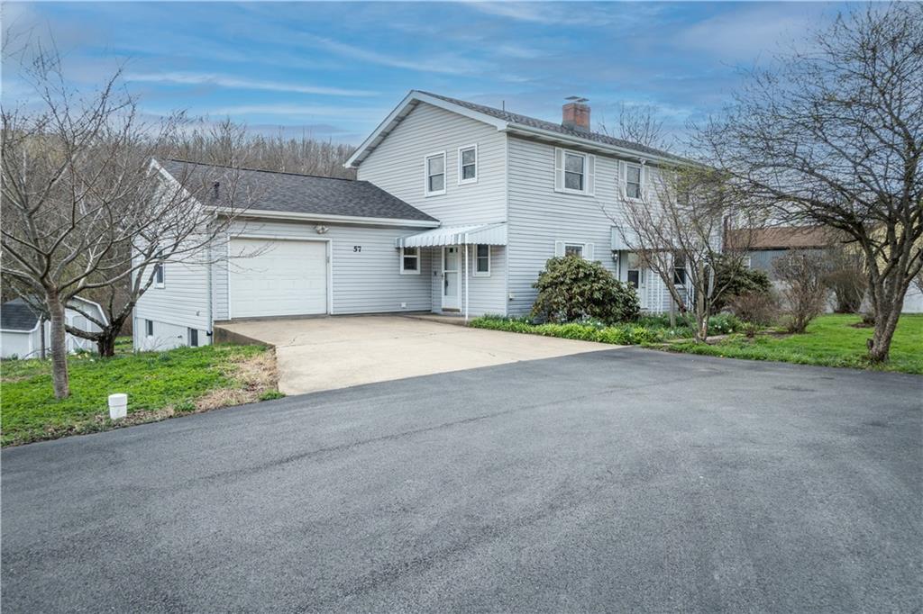 57 Shick Drive Indiana, PA 15701 - Photo 1 of 48 a front view of house with garage and yard