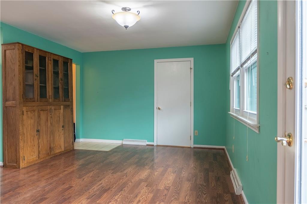 57 Shick Drive Indiana, PA 15701 - Photo 12 of 48 an empty room with wooden floor and windows