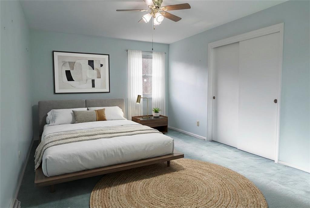 57 Shick Drive Indiana, PA 15701 - Photo 25 of 48 a bedroom with a bed and a chandelier
