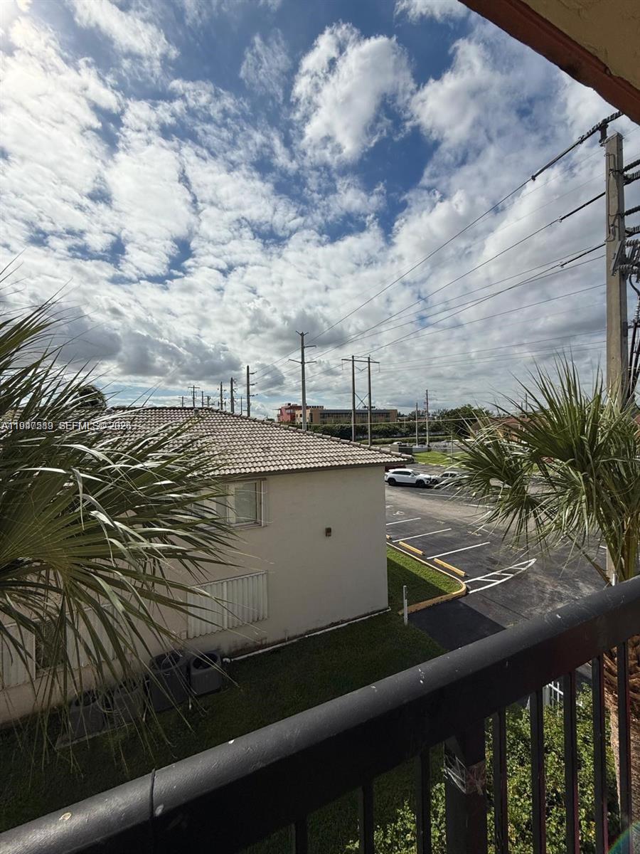 5290 West 21st Court, Unit 307 Hialeah, FL 33016 - Photo 11 of 22 a view of a lake from a balcony