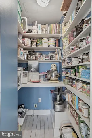 a room with furniture and view of living room