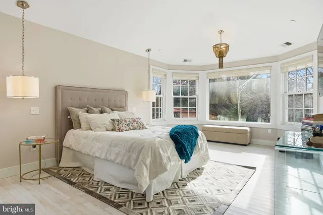 a view of a house with backyard porch and sitting area