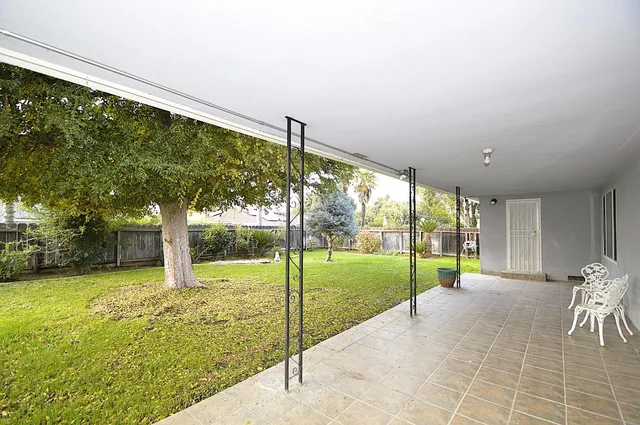 a view of a porch and garden