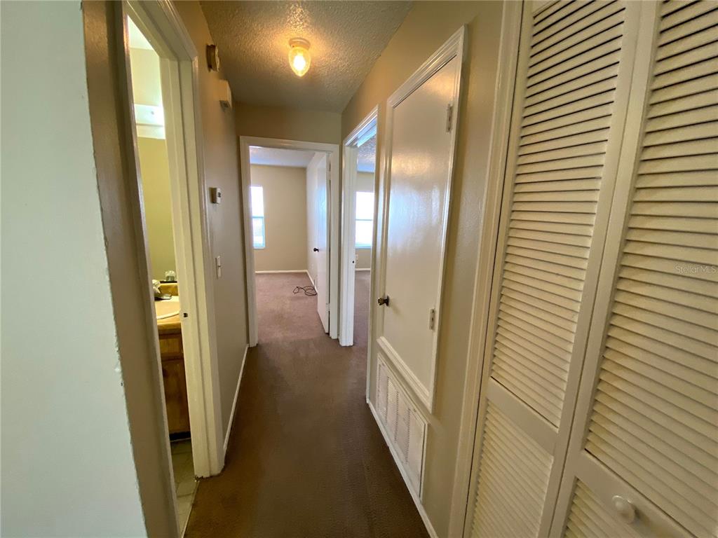 4148 Pershing Pointe Place, Unit 1 Orlando, FL 32822 - Photo 14 of 33 a view of a hallway with a door