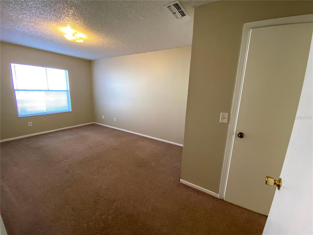 4148 Pershing Pointe Place, Unit 1 Orlando, FL 32822 - Photo 15 of 33 an empty room with a window