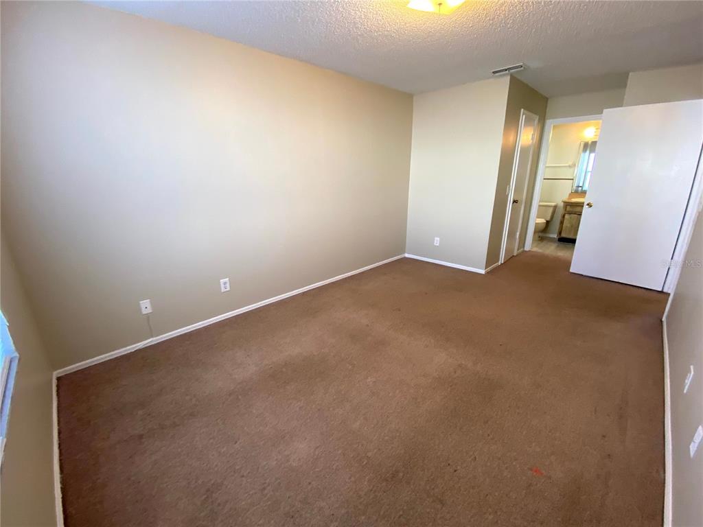 4148 Pershing Pointe Place, Unit 1 Orlando, FL 32822 - Photo 17 of 33 a view of an empty room