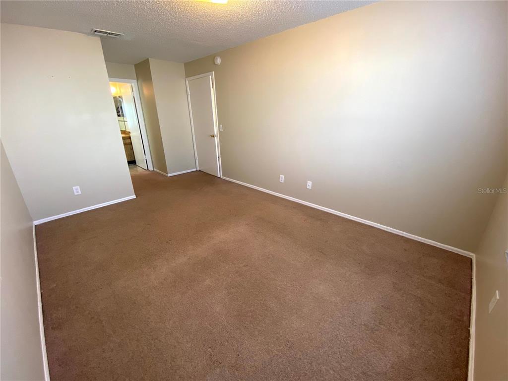 4148 Pershing Pointe Place, Unit 1 Orlando, FL 32822 - Photo 18 of 33 a view of empty room