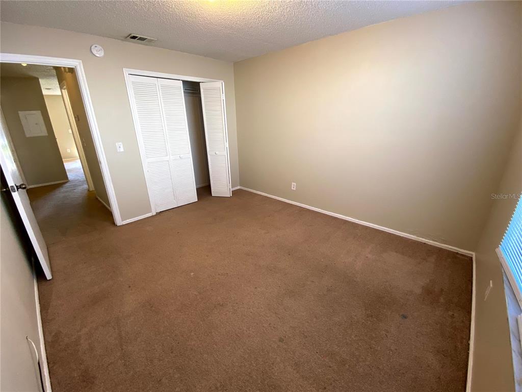 4148 Pershing Pointe Place, Unit 1 Orlando, FL 32822 - Photo 25 of 33 an empty room with windows