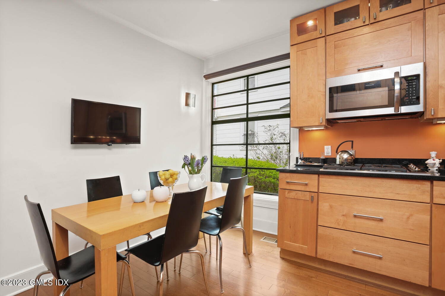 65 Ridge Street Greenwich, CT 06830 - Photo 12 of 35 a view of a dining room with furniture and wooden floor