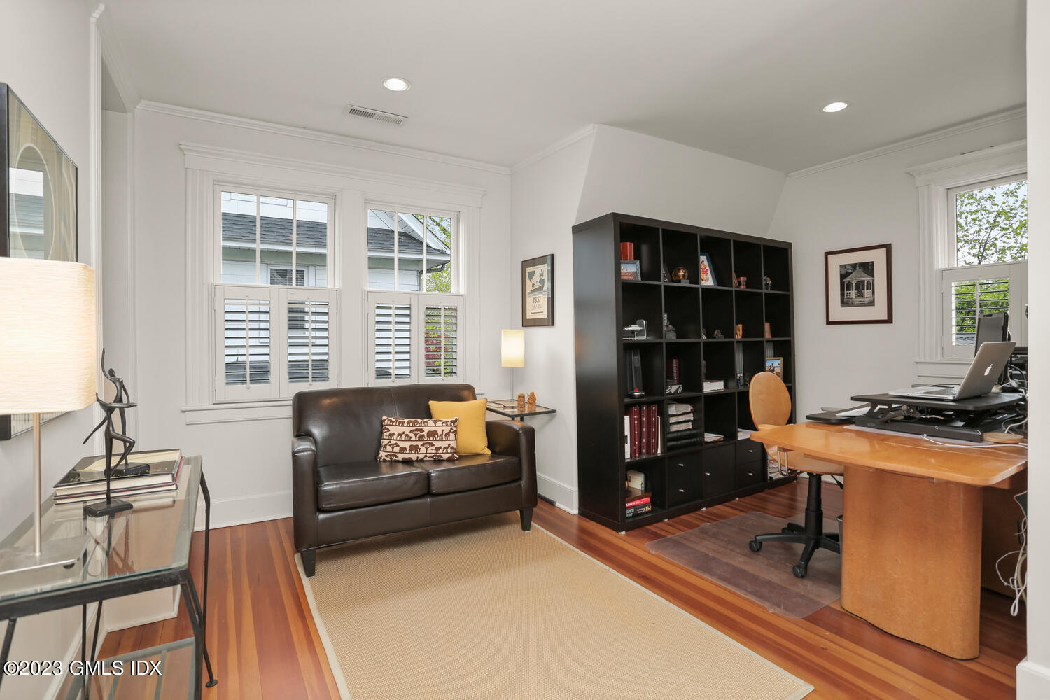 65 Ridge Street Greenwich, CT 06830 - Photo 16 of 35 a livingroom with workspace and a window