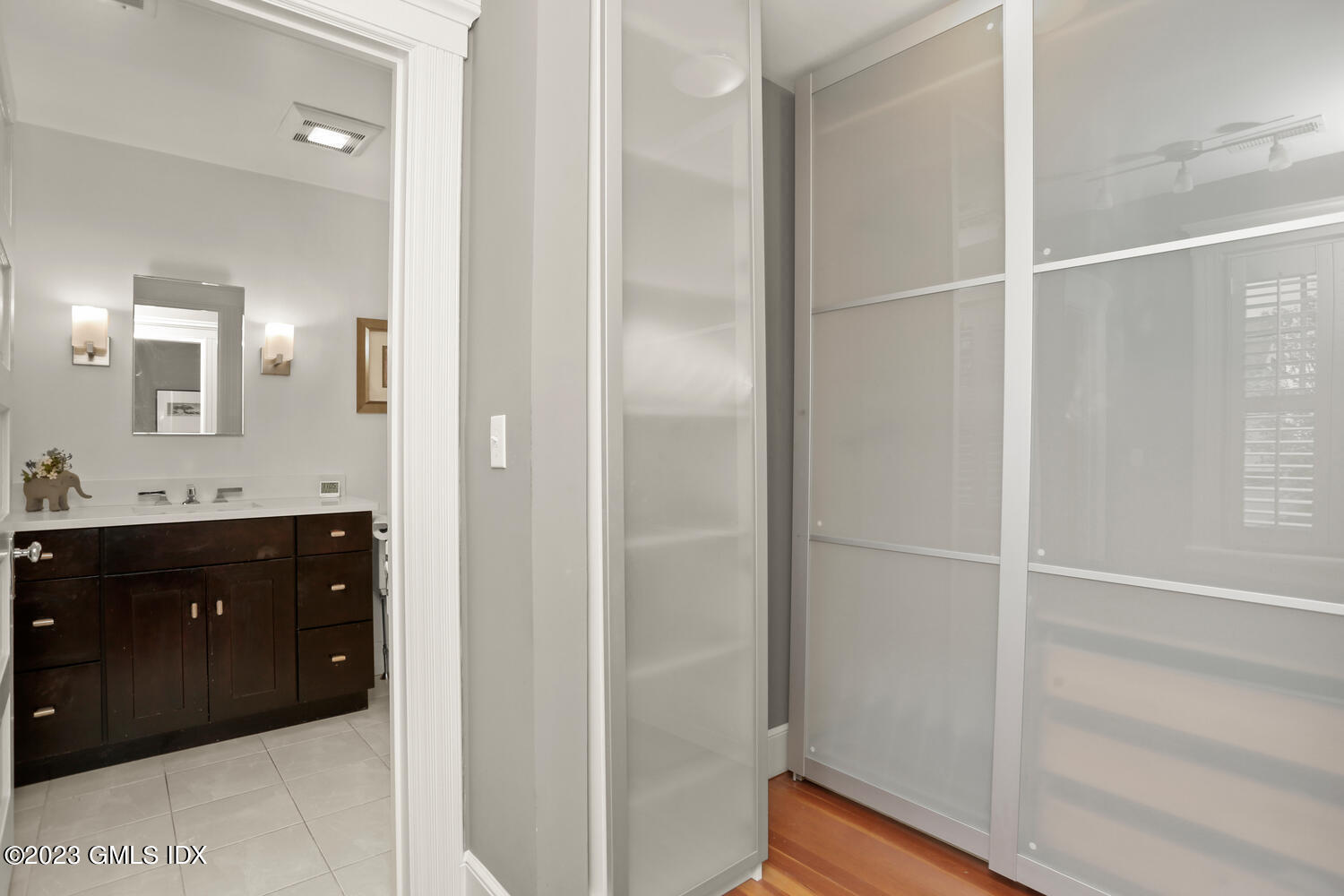 65 Ridge Street Greenwich, CT 06830 - Photo 19 of 35 a bathroom with a sink vanity and a mirror
