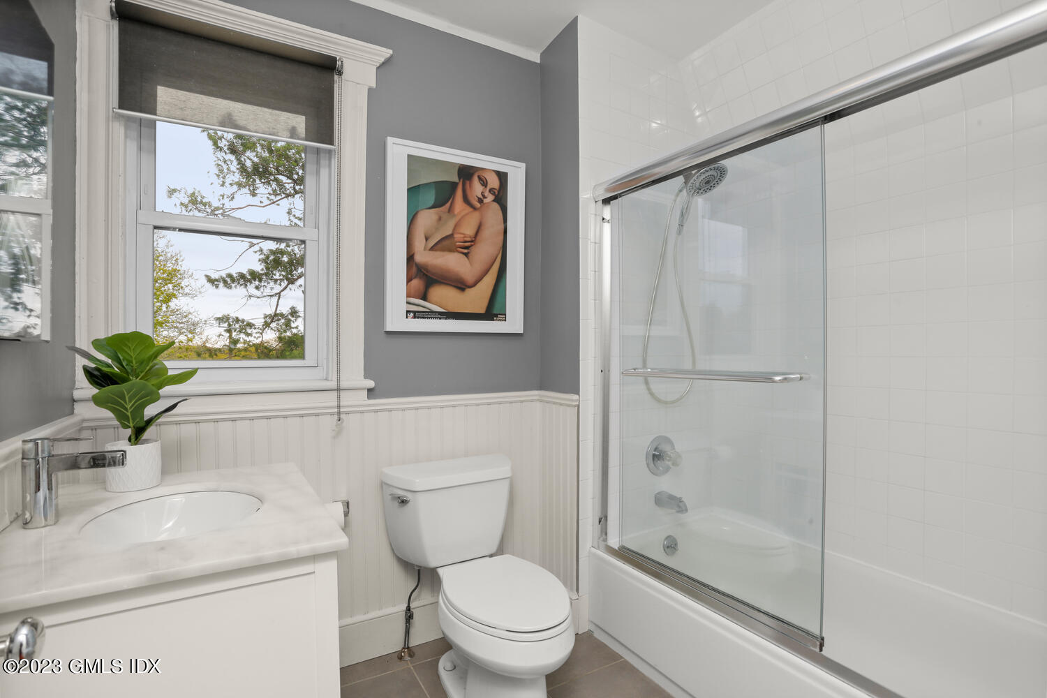 65 Ridge Street Greenwich, CT 06830 - Photo 23 of 35 a white toilet sitting next to a bathroom sink