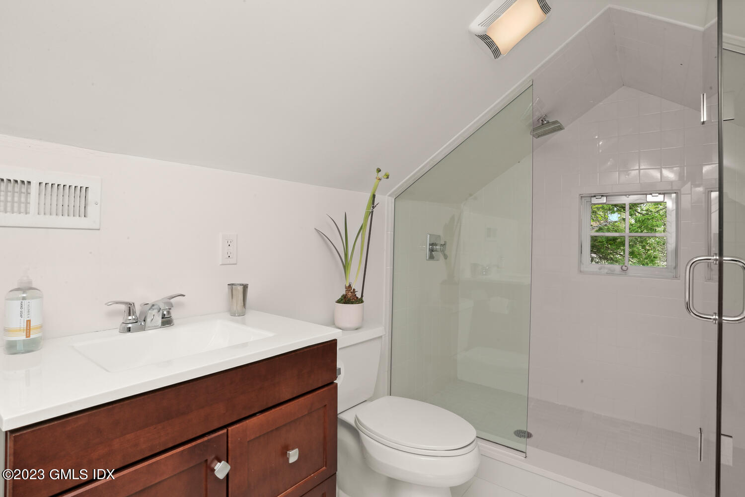 65 Ridge Street Greenwich, CT 06830 - Photo 25 of 35 a bathroom with a sink a toilet a shower and a mirror