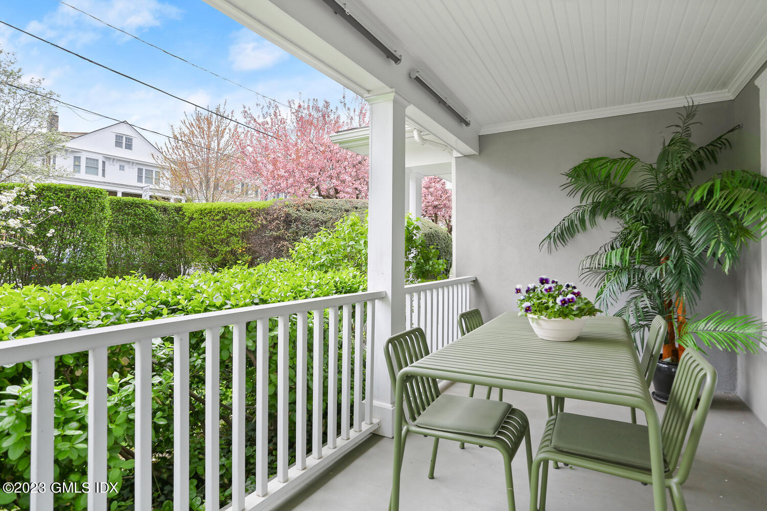 65 Ridge Street Greenwich, CT 06830 - Photo 26 of 35 a view of a patio with a table chairs and a potted plant