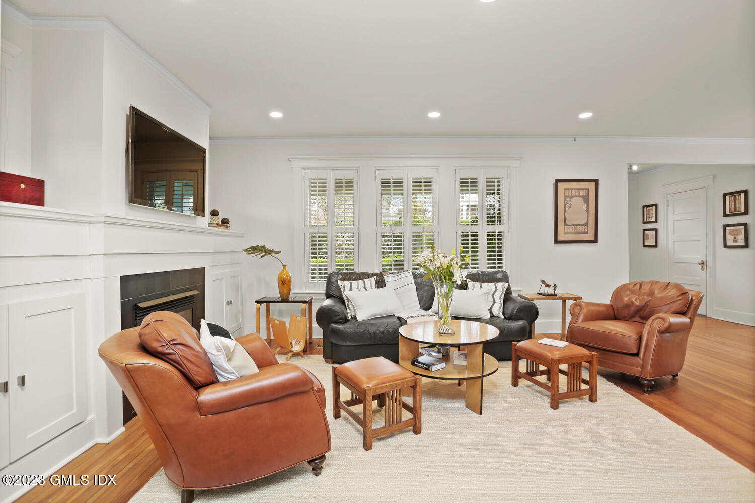 65 Ridge Street Greenwich, CT 06830 - Photo 6 of 35 a living room with furniture fireplace and a flat screen tv