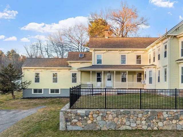 an aerial view of a house with outdoor space