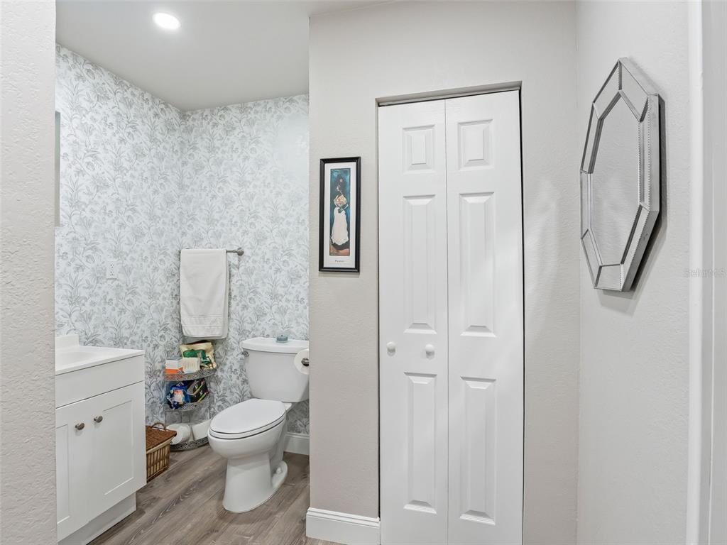 3505 Northeast 97th Street Road Anthony, FL 32617 - Photo 21 of 38 a white toilet sitting next to a bathroom sink