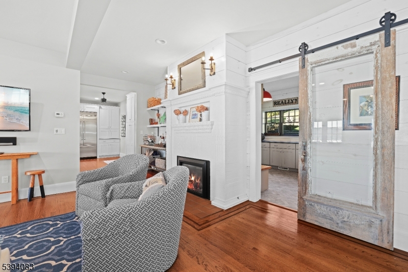331 Lakeside Boulevard Hopatcong, NJ 07843 - Photo 11 of 34 a living room with furniture and a door
