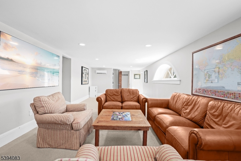 331 Lakeside Boulevard Hopatcong, NJ 07843 - Photo 20 of 34 a living room with furniture and a large window