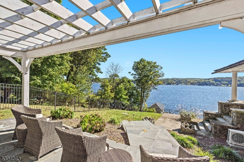 331 Lakeside Boulevard Hopatcong, NJ 07843 - Photo 24 of 34 a view of a patio with couches table and chairs and potted plants