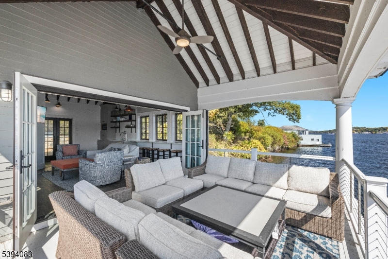 331 Lakeside Boulevard Hopatcong, NJ 07843 - Photo 29 of 34 a living room with furniture and a large window