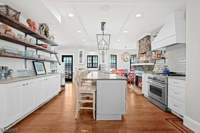 a kitchen with white cabinets and appliances