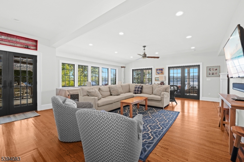 331 Lakeside Boulevard Hopatcong, NJ 07843 - Photo 9 of 34 a living room with furniture and a wooden floor