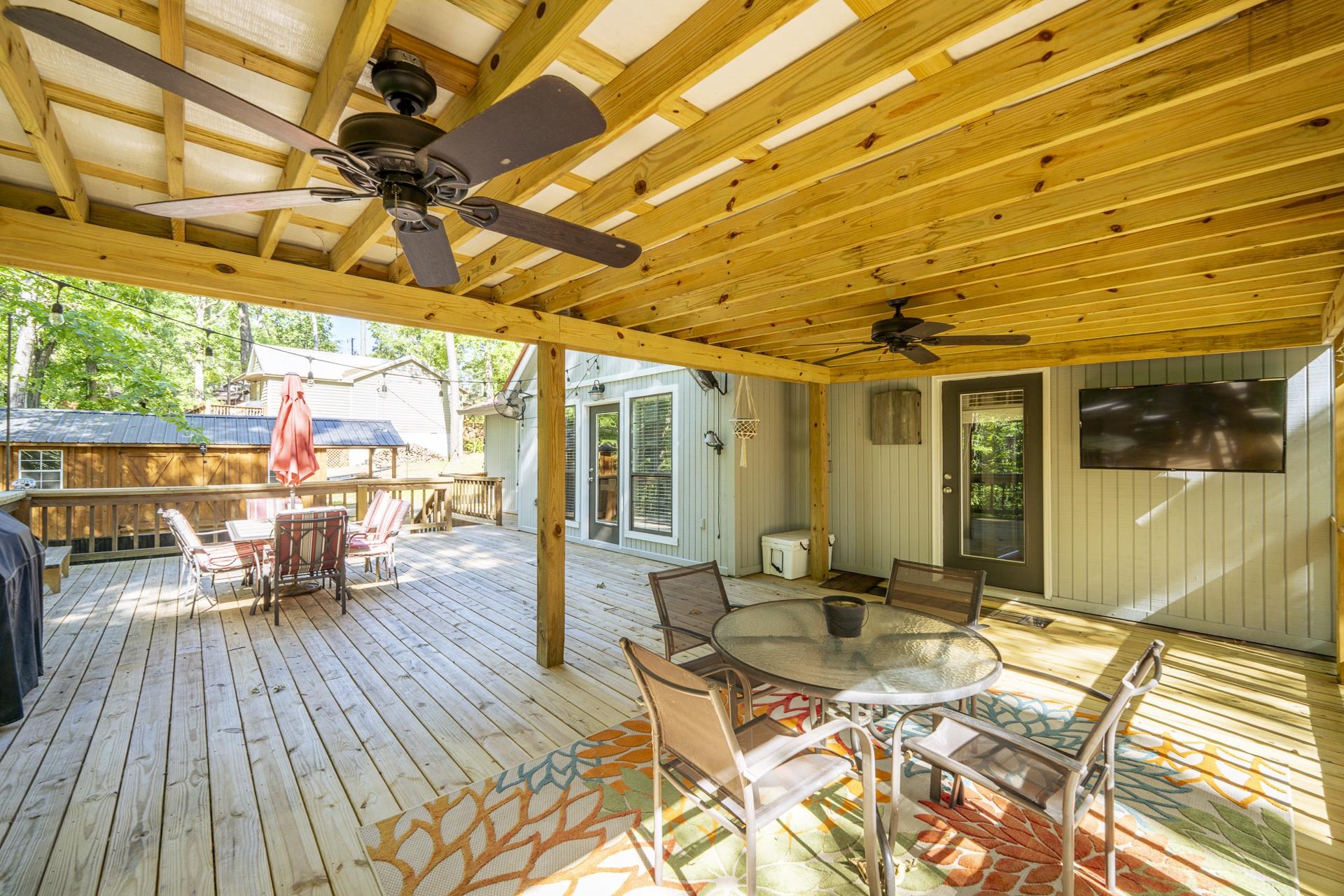 80 Contreau Road Counce, TN 38326 - Photo 23 of 28 a view of a patio with table and chairs and wooden floor